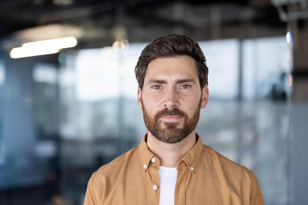 confident professional in a modern office representing who buys promissory notes
